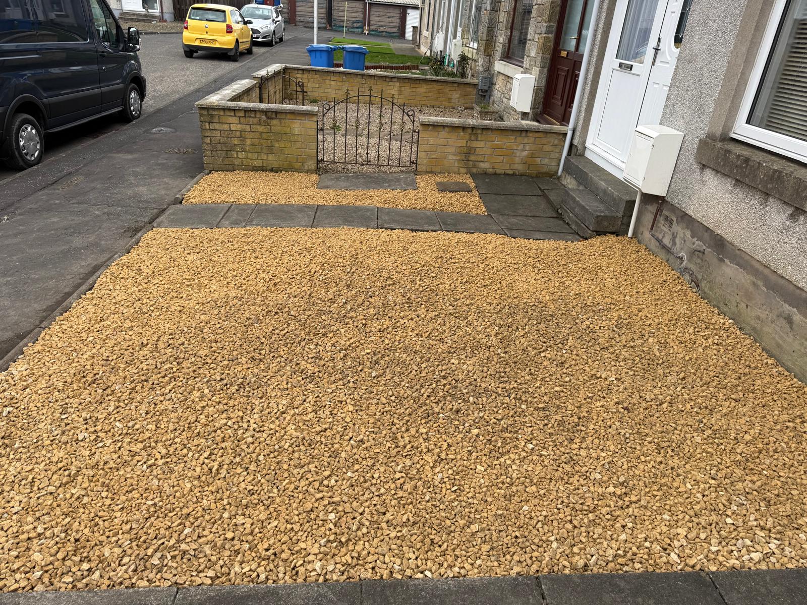 Golden gravel front garden with neat edging and clean finish
