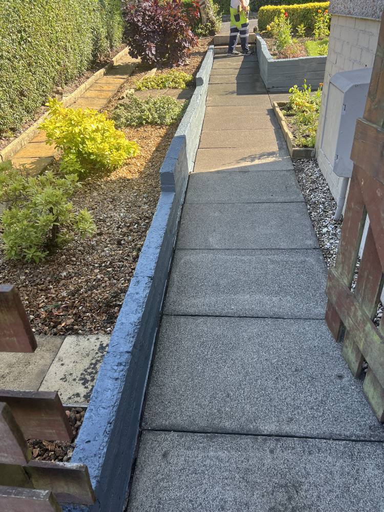 Granite path edging in front garden with planting beds