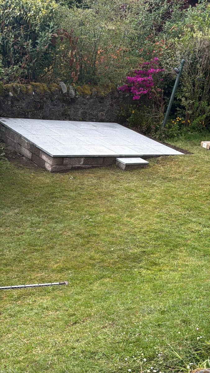 Completed granite slab greenhouse base in a garden